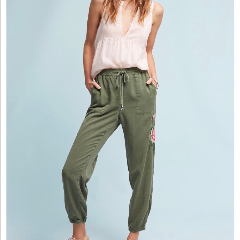 Anthropologie Green joggers w/ embroidered flower